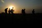 Tenth Air Support Operations Squadron joint terminal attack controllers march through a field during land navigation operations, June 22, 2016, at Fort Riley, Kan. Tenth ASOS JTAC Airmen participated in a field training exercise facilitated to ensure all Airmen are currently proficient, physically fit and mentally prepared to conduct close air support operation missions world-wide.  (U.S. Air Force photo/Airman 1st Class Jenna K. Caldwell)