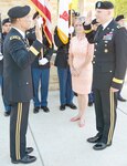 Maj. Gen. Joseph Caravalho Jr. administers the oath of office to Brig. Gen.Jeffrey Johnson during a promotion ceremony June 21 at the Warrior and Family Support Center Amphitheater at Fort Sam Houston. Caravalho is the Joint Staff Surgeon at the Pentagon and former BAMC commander.