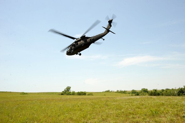 A UH-60 Blackhawk departs during a recovery exercise, June 22, 2016, at Fort Riley, Kan. The UH-60 is a front-line utility helicopter used for air assaults, air cavalry, medical evacuations and special operations missions.  (U.S. Air Force photo/Airman 1st Class Jenna K. Caldwell)