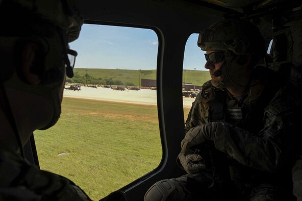 Master Sgt. Benjamin Jenkins, 10th Air Support Operations Squadron, chief joint terminal attack control instructor, stares out the window as a UH-60 Blackhawk approaches the flightline to land, June 22, 2016, at Fort Riley, Kan. Tenth ASOS JTAC Airmen participated in a field training exercise to facilitate a combat mission ready posture within the squadron. (U.S. Air Force photo/Airman 1st Class Jenna K. Caldwell) 