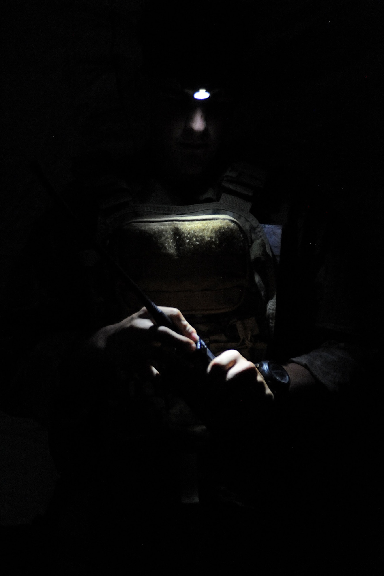 Airman 1st Class Benjamin Anderson, 10th Air Support Operations Squadron joint terminal attack controller, reads a map inside an operation center, June 22, 2016, at Fort Riley, Kan. Tenth ASOS JTAC Airmen conducted field and convoy exercises to maintain readiness as tactical air control party operators. (U.S. Air Force photo/Airman 1st Class Jenna K. Caldwell)