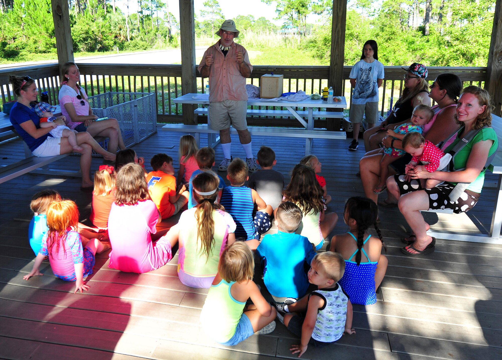 Todd Quinn, a zoology instructor at Lighthouse Christian Academy, talks to Hurlburt Field children about different types of wildlife duing a Key Spouse and Deployed Family Barbeque at the Soundside Marina on Hurlburt Field, Fla., June 23, 2016. The family and spouses of deployed Airmen were invited to the monthly dinner event, hosted by the Airmen and Family Readiness Center, to enjoy a night with other deployed families and build a support system while their spouses are away. (U.S. Air Force photo by Staff Sgt. Kentavist P. Brackin)