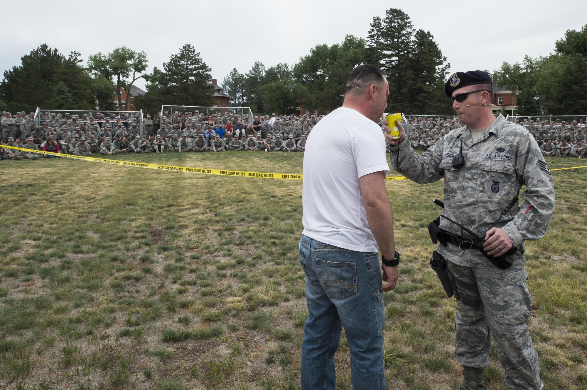 Staff Sgt. James Hebert, a 90th Security Forces Squadron member, administers a breathalyzer test to Staff Sgt. Johnathan Avila, 90th Civil Engineering Squadron water and fuels system technician, during a drinking and driving awareness event at F.E. Warren Air Force Base, Wyo., June 30, 2016. More than 200 Airman from the 90th Missile Wing attended the event to witness firsthand the devastating effects of a DUI. (U.S. Air Force photo by Staff Sgt. Christopher Ruano)