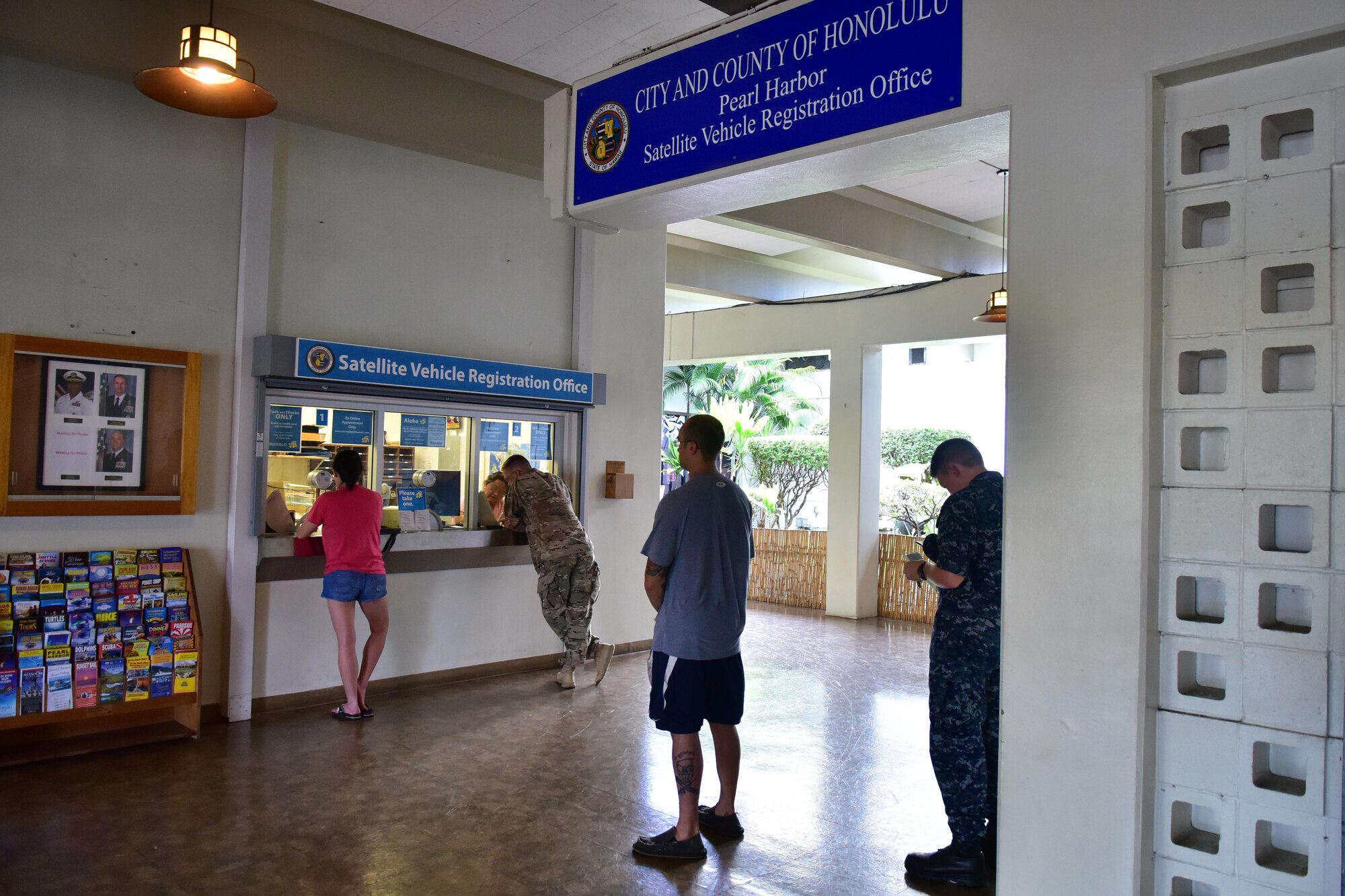 Servicemembers and their families wait for their appointment at the Satellite Vehicle Registration Office on Joint Base Pearl Harbor-Hickam, June 14, 2016. The benefits provided by the Pearl Harbor DMV include registering vehicles, out of state permits, transfer of ownership, replacement/ordering new plates, updating information, and providing particulars for other services outside of motor vehicles.
(U.S. Air Force photo by Tylyn Taylor/Released)
