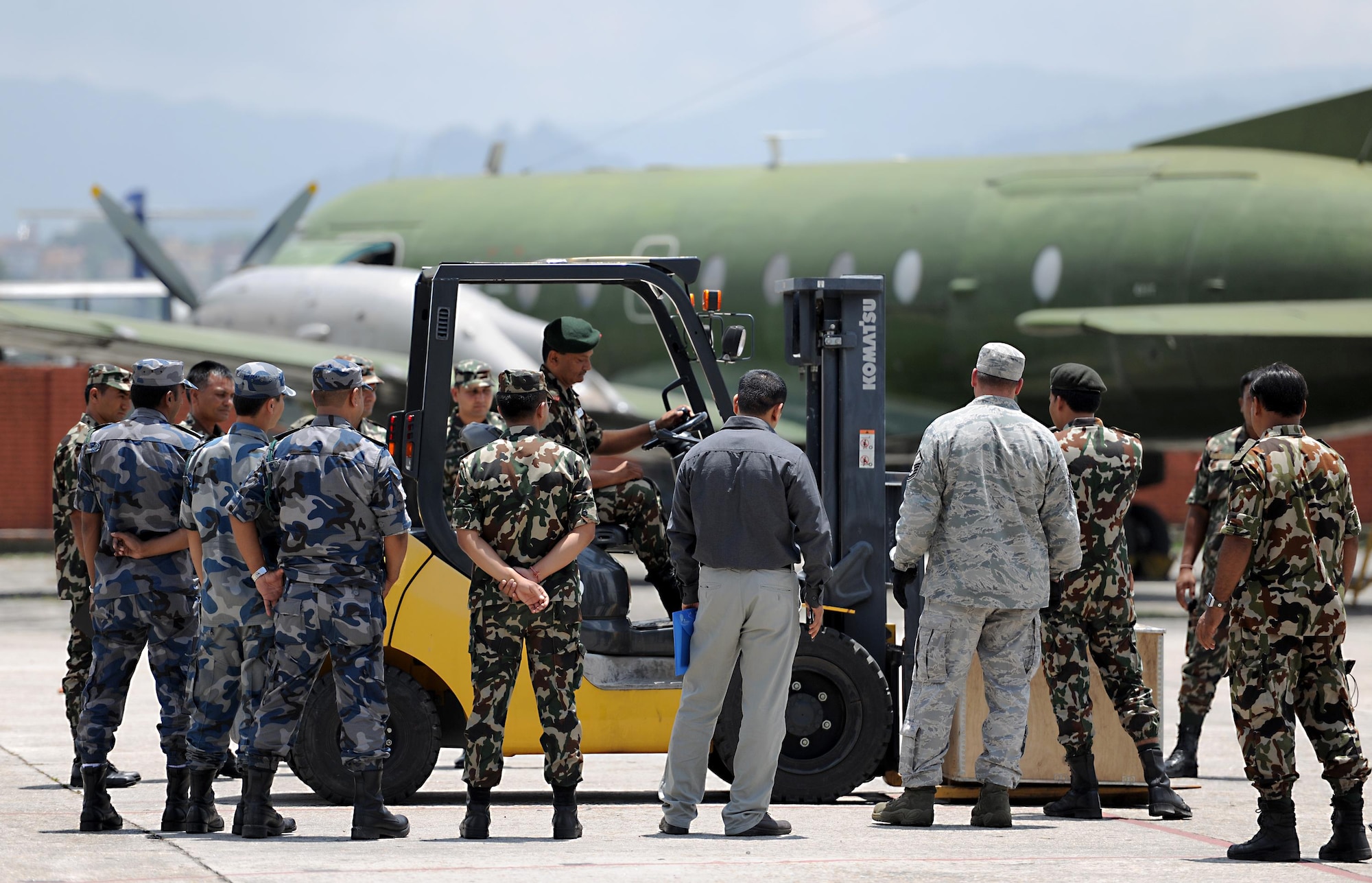Participants of a subject-matter expert exchange on cargo handling learn how to operate a forklift June 28, 2016, at Tribhuvan International Airport in Kathmandu, Nepal. During the SMEE, participants familiarized themselves with forklift operation and learned cargo transportation techniques. (U.S. Air Force photo by Staff Sgt. Benjamin Gonsier/Released)
