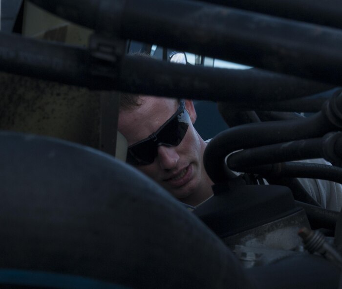 U.S. Air Force Staff Sgt. Aaron Paecht, 18th Logistics Readiness Squadron assistant NCO in charge of training, validation and operations, inspects parts of a tractor-trailer during training June 29, 2016, at Kadena Air Base, Japan. A thorough inspection of the different parts of the tractor-trailer is necessary before conducting any missions. (U.S. Air Force photo by Airman 1st Class Lynette M. Rolen)