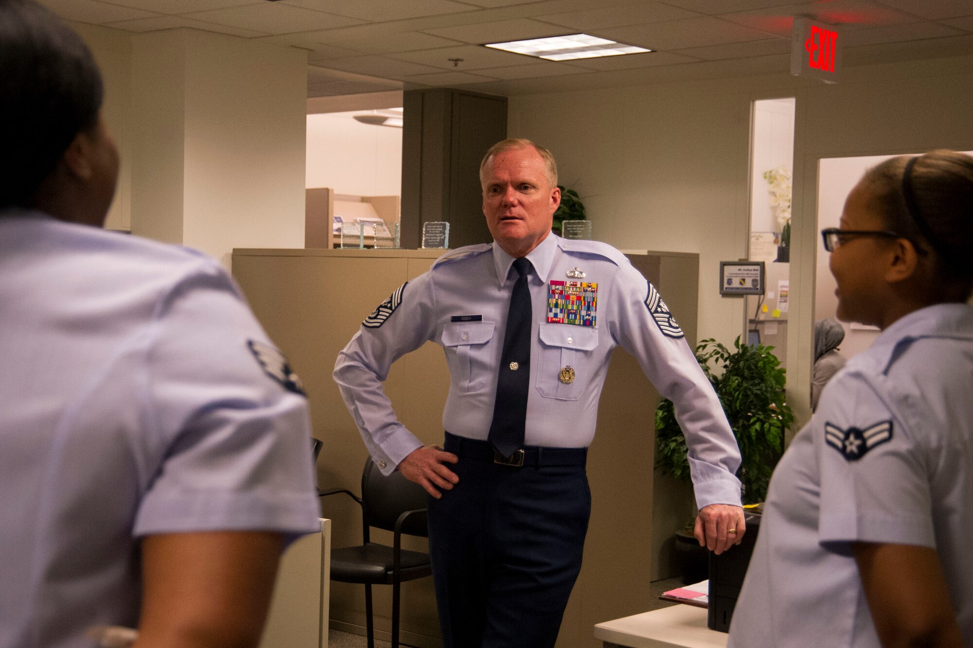 Chief Master Sgt. of the Air Force James A. Cody talks with members of the 811th Force Support Squadron during his tour of the 811th FSS at the Pentagon in Arlington, Va., June 28, 2016. Cody visited the unit to see firsthand how they execute the mission. The unit, an 11th Wing asset, provides personnel support, continuing education opportunities, recreation services and deployment and family readiness services to military, civilians and retirees and dependents in the National Capitol Region. (U.S. Air Force photo by Airman Gabrielle Spalding)