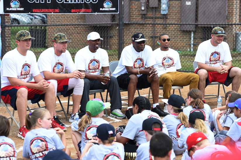 Washington Nationals team members (from left to right) Sammy Solis, pitcher, Blake Treinen, pitcher, Jacque Jones, assistant hitting coach, Johnnie “Dusty” Baker, manager, Ben Revere, outfielder, and Clint Robinson, first baseman, do a Q&A with children of military personnel at the Major League Baseball Players Trust City Clinic’s youth baseball clinic on Joint Base Andrews, Md., June 28, 2016. The Players Trust, DC Grays, a Cal Ripken Collegiate Baseball League team, and USO Metro coordinated this event. More than 100 children attended the clinic, receiving coaching from collegiate and professional baseball players, as well as free baseballs, gloves, T-shirts and autograph cards. (U.S. Air Force photo by Senior Airman Joshua R. M. Dewberry)