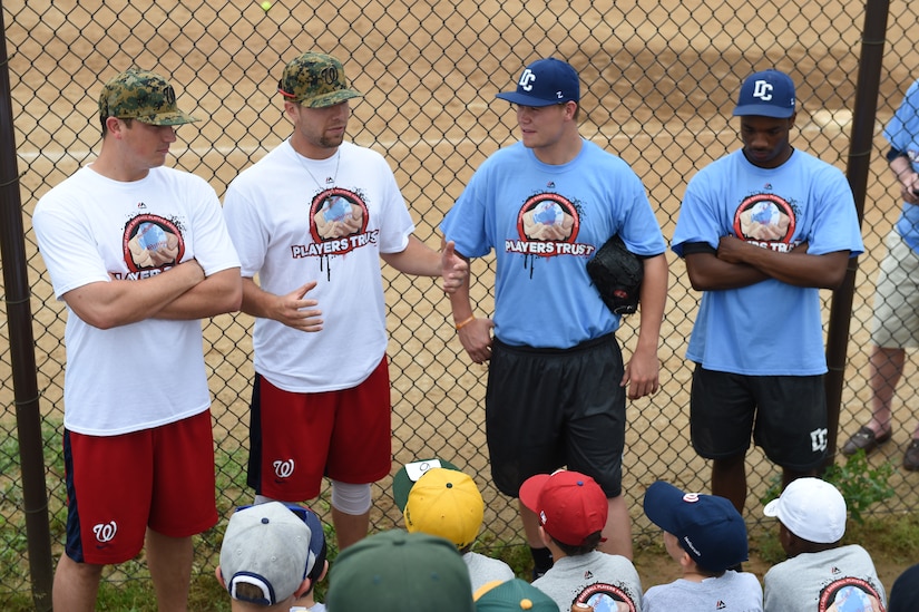 Washington Nationals pitchers Sammy Solis (outer left) and Blake Treinen (inner left), along with collegiate baseball players, answer questions from children of military personnel at the Major League Baseball Players Trust City Clinic’s youth baseball clinic on Joint Base Andrews, Md., June 28, 2016. The Players Trust, DC Grays, a Cal Ripken Collegiate Baseball League team, and USO Metro coordinated this event. More than 100 children attended the clinic, receiving coaching from collegiate and professional baseball players, as well as free baseballs, gloves, T-shirts and autograph cards. (U.S. Air Force photo by Senior Airman Joshua R. M. Dewberry)