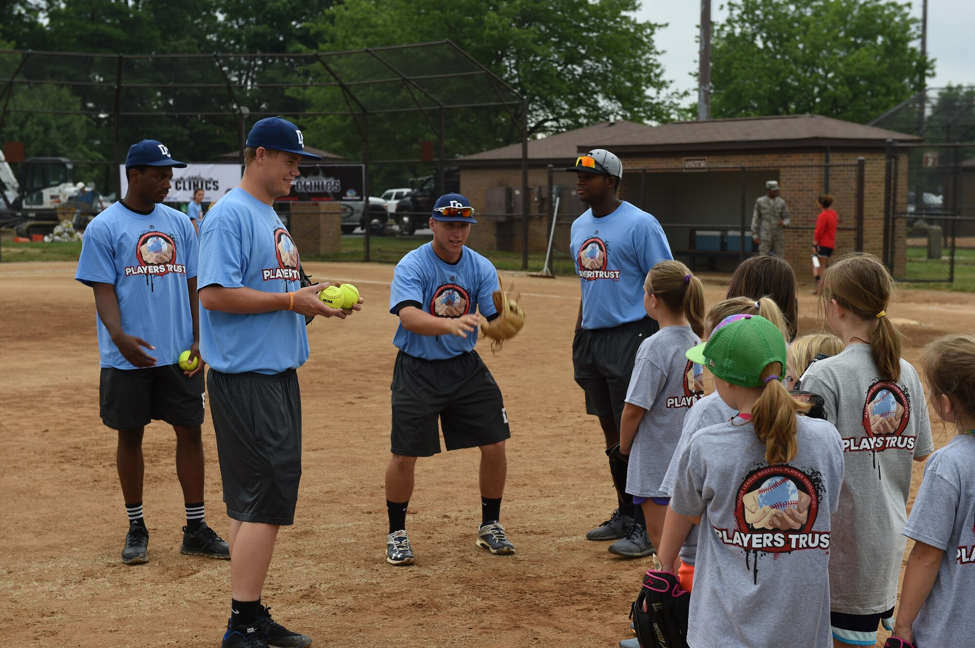 Collegiate baseball players teach pitching and catching fundamentals with children of military personnel at the Major League Baseball Players Trust City Clinic’s youth baseball clinic on Joint Base Andrews, Md., June 28, 2016. The Players Trust, DC Grays, a Cal Ripken Collegiate Baseball League team, and USO Metro coordinated this event. More than 100 children attended the clinic, receiving coaching from collegiate and professional baseball players, as well as free baseballs, gloves, T-shirts and autograph cards. (U.S. Air Force photo by Senior Airman Joshua R. M. Dewberry)