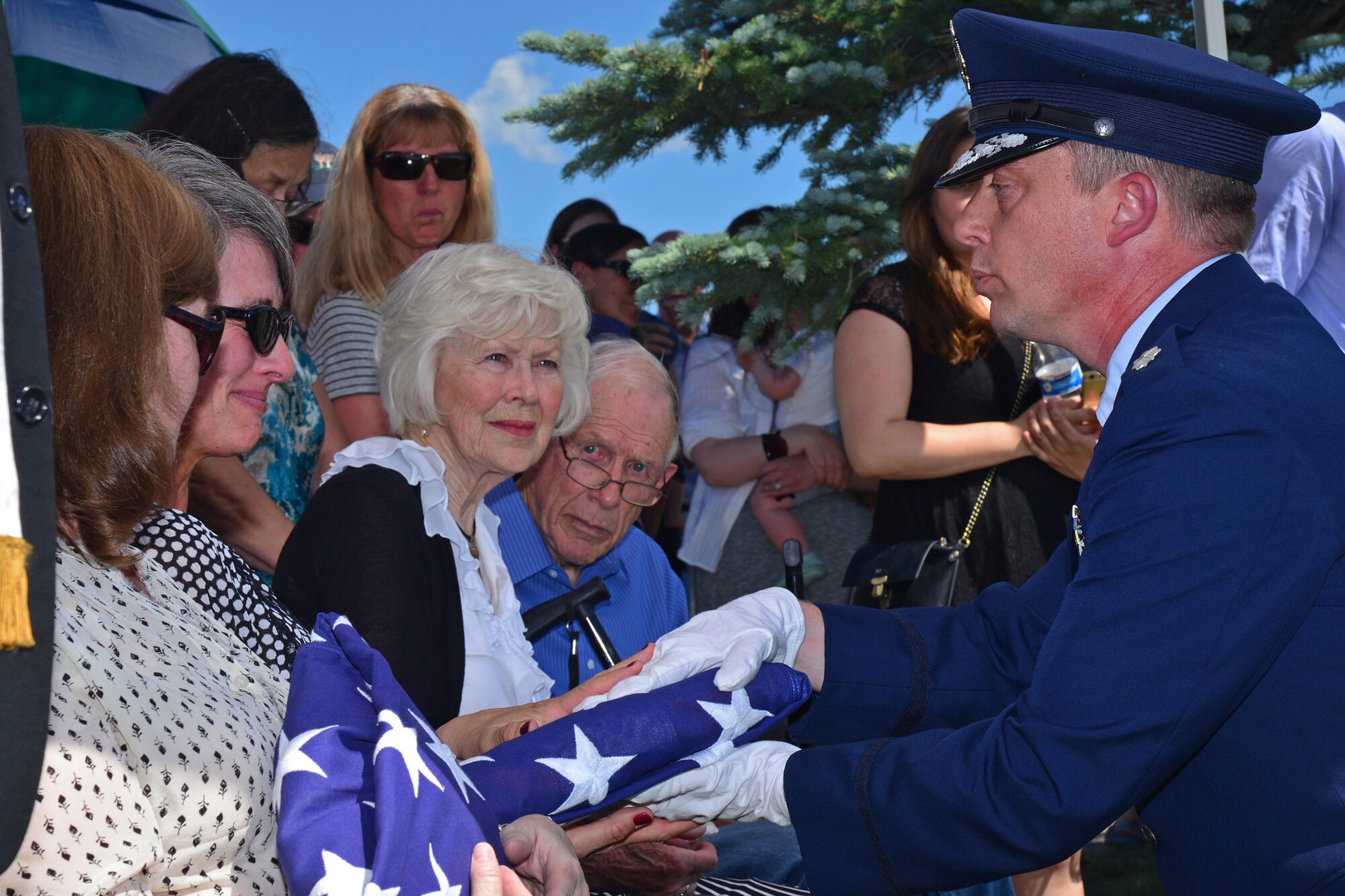 Lt. Col. Michael Epper, 341st Force Support Squadron commander, presents an American flag to retired Gen. Robert Mathis’ family during his funeral June 29, 2016, in Bozeman, Mont. Mathis served 34 years in the U.S. Air Force, and was the vice chief of staff of the Air Force 1980-1982. (U.S. Air Force photo/ Airman 1st Class Daniel Brosam)