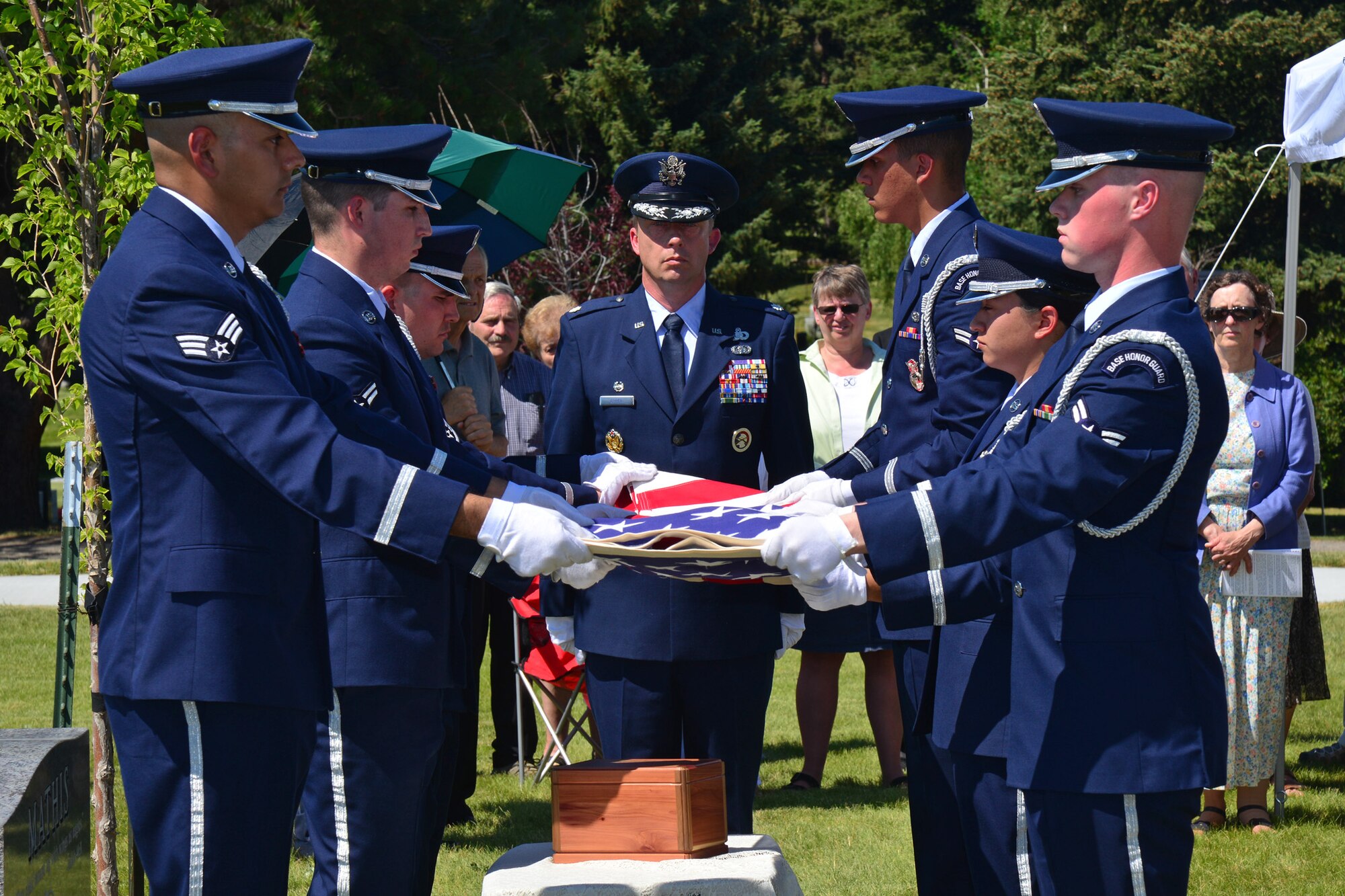Members of the Malmstrom Air Force Base Honor Guard perform a flag folding ceremony during a funeral service for retired Gen. Robert Mathis June 29, 2016, in Bozeman, Mont. Mathis served 34 years in the U.S. Air Force, and was the vice chief of staff of the Air Force 1980-1982. (U.S. Air Force photo/ Airman 1st Class Daniel Brosam)