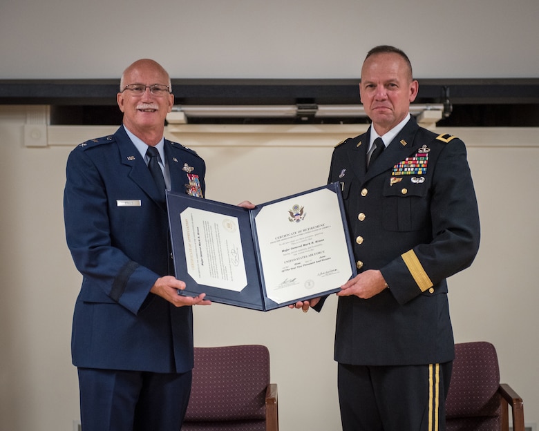 Maj. Gen. Mark R. Kraus (left), Air National Guard assistant to the commander, United States Air Forces Central Command, is presented with his Certificate of Retirement by Brig. Gen. Stephen R. Hogan, Kentucky’s adjutant general, during Kraus’ retirement ceremony at the Kentucky Air National Guard Base in Louisville, Ky., June 12, 2016.  Kraus served for more than 43 years in the United States Air Force and Air National Guard. (U.S. Air National Guard photo by Master Sgt. Phil Speck)