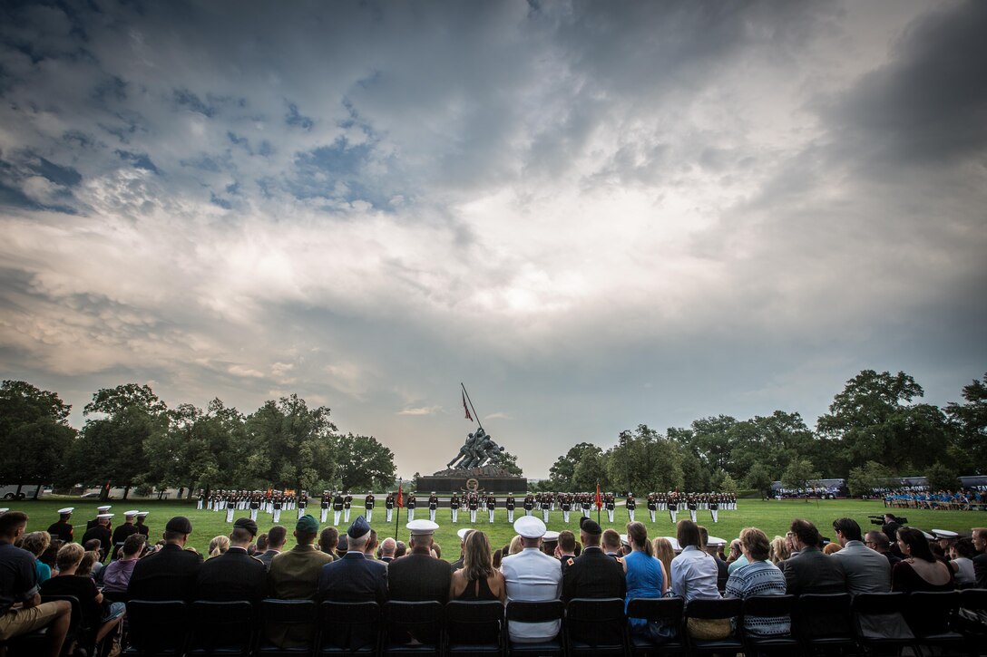 The 18th Sergeant Major of the Marine Corps, Ronald L. Green, hosts a Sunset Parade at the Marine Corps War Memorial, Arlington, VA., June 28, 2016. The parade's Guest of Honor was Dr. Rory Cooper, and included performances from the Marine Drum and Bugle Corps and the Silent Drill Platoon. (U.S. Marine Corps photo by Sgt. Melissa Marnell, Office of the Sergeant Major of the Marine Corps/Released)