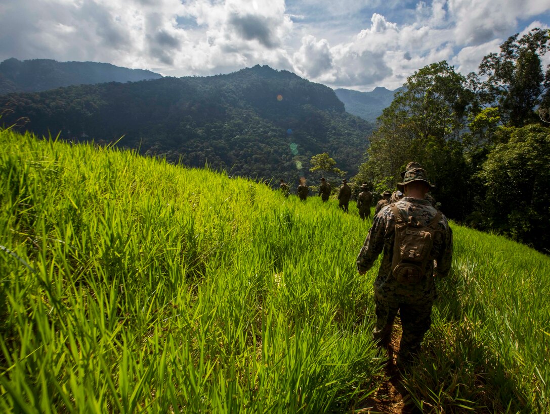 U.S. Marines with Task Force Koa Moana and the Papua New Guinea Defence Force, hike the historical Kokoda trail during Exercise Koa Moana, Papua New Guinea, June 22, 2016. In 1942 ammunition and supplies were trucked 45 kilometers from Port Moresby to Owers where they were repacked in Uberi, a major supply base just beyond the Goldie River. From Uberi only sure-footed native carriers were able to traverse the tortuous track ahead.   (U.S. Marine Corps imagery by MCIPAC Combat Camera Lance Cpl. Jesus McCloud/ Released)