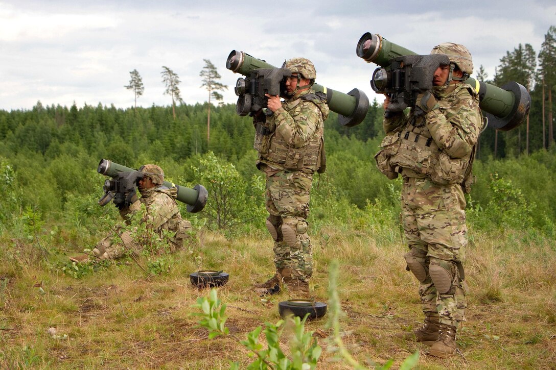 Left to right: Army Spcs. Benjamin Sherman, Jose Enriquez and Pvt. Joseph Morales prepare to fire their javelin anti-tank missiles at targets during Saber Strike 16 in Tapa, Estonia, June 20, 2016. Sherman, Enriquez and Morales are cavalry scouts assigned to the 2nd Cavalry Regiment. Army photo by Staff Sgt. Jennifer Bunn