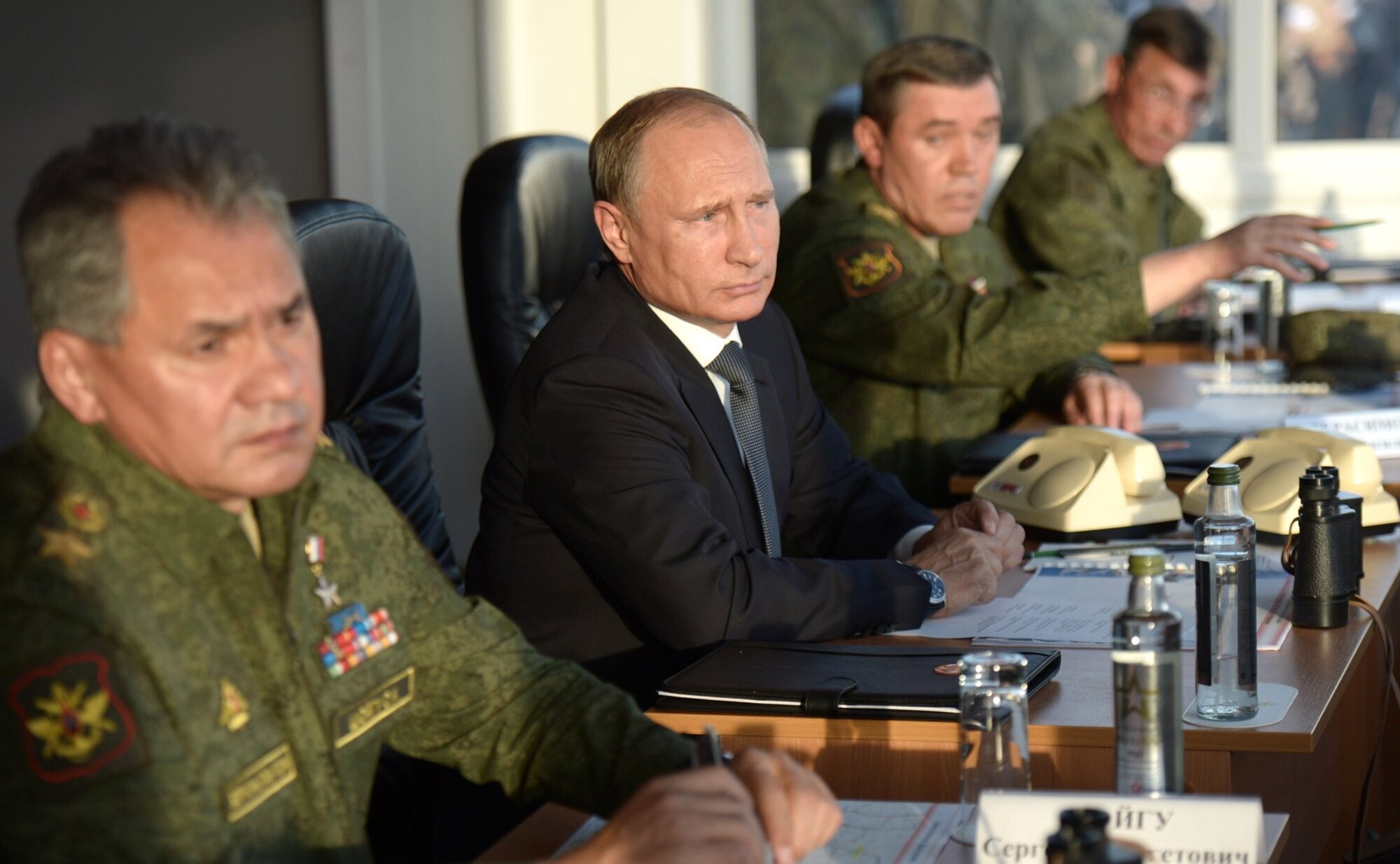 Russian President Vladimir Putin and some of his top military brass, including Defense Minister Sergey Shoygu (left)