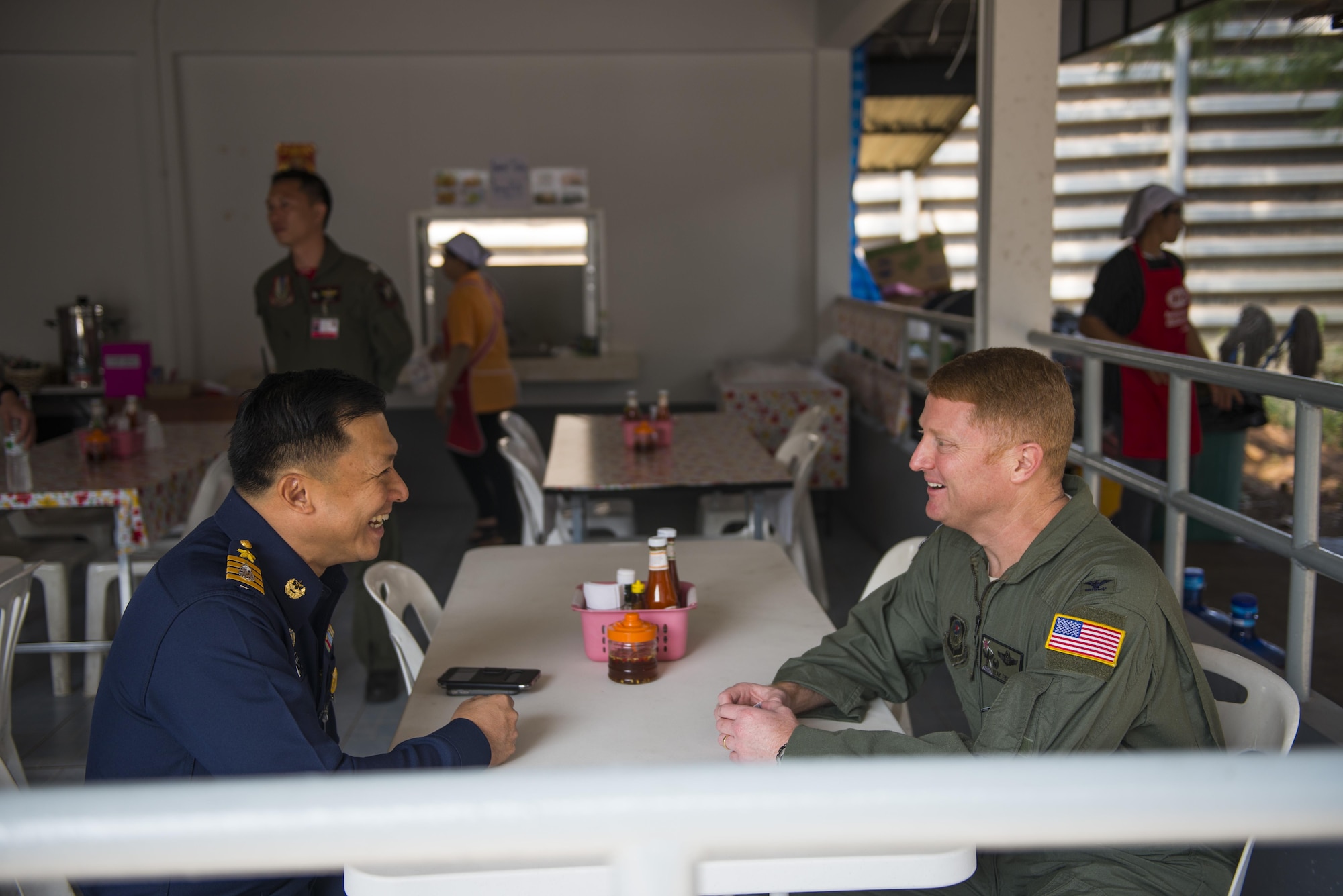 Royal Thai Air Force Group Capt. Tanaset Thamamnuaykij, 23rd Wing Air Combatant Command commander, talks with U.S. Air Force Col. William Freeman, 353rd Special Operations Group commander, about exercise Cobra Gold and plans for future exercises, Udon Thani, Thailand, Feb. 18, 2016. Cobra Gold is a Thai-U.S. co-sponsored exercise that represents the longstanding friendship between the Thai and American peoples. (U.S. Air Force photo by Senior Airman Stephen G. Eigel)