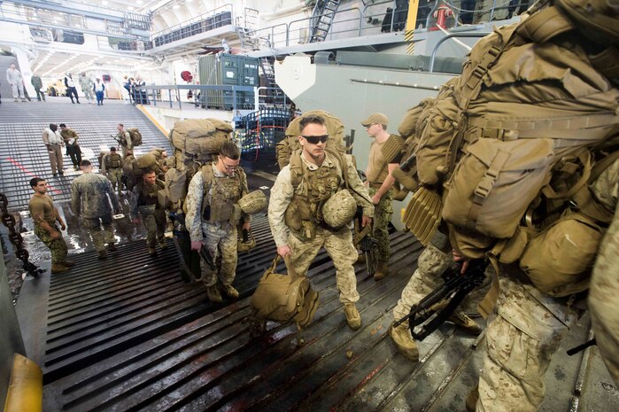 (Feb. 18, 2016) U.S. Marines load onto a landing craft utility
(LCU) in the well deck aboard the amphibious transport dock ship USS Arlington (LPD 24) as part of Amphibious Landing Exercise (PHIBLEX) 16. The U.S. Navy, U.S. Marine Corps, and Kuwait Armed Forces are conducting PHIBLEX 16, a bilateral amphibious and ground exercise, to enhance operational readiness and improve interoperability between U.S. and regional partner forces. 