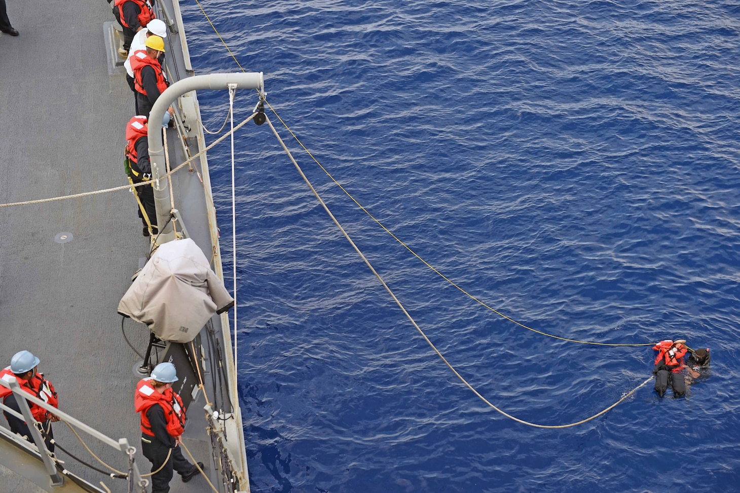 160125-N-KM939-603
PACIFIC OCEAN (Jan. 25, 2016) - Seaman Steve Martinez, from Pueblo, Colorado, saves “Oscar,” the rescue dummy, during a man overboard drill on the guided-missile destroyer USS Stockdale (DDG 106). Providing a ready force supporting security and stability in the Indo-Asia-Pacific, Stockdale is operating as part of the John C. Stennis Strike Group and Great Green Fleet on a regularly scheduled 7th Fleet deployment. (U.S. Navy photo by Mass Communication Specialist 3rd Class David A. Cox/Released)