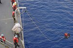 160125-N-KM939-603
PACIFIC OCEAN (Jan. 25, 2016) - Seaman Steve Martinez, from Pueblo, Colorado, saves “Oscar,” the rescue dummy, during a man overboard drill on the guided-missile destroyer USS Stockdale (DDG 106). Providing a ready force supporting security and stability in the Indo-Asia-Pacific, Stockdale is operating as part of the John C. Stennis Strike Group and Great Green Fleet on a regularly scheduled 7th Fleet deployment. (U.S. Navy photo by Mass Communication Specialist 3rd Class David A. Cox/Released)