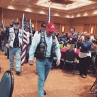 Patriot Guard Riders receive a standing ovation from service members and their families attending the Air Force Reserve Yellow Ribbon event in Orlando Feb. 27-28. The PGR's main mission is to attend the funeral services of fallen American heroes as invited guests of the family They went to the YR event to introduce their mission and show their support to Air Force reservists. The Yellow Ribbon Program is a series of events designed to provide members and families with essential resources prior to departure (pre-deployment), a level of stability and support while deployed (during deployment), and successful re-integration techniques after the deployment cycle ends (post deployment). (U.S. Air Force photo/2nd Lt. Anna-Marie Wyant) 
