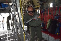 First Lt. J.C. Allen, 433rd Aeromedical Evacuation Squadron flight nurse, secures a stretcher aboard a C-130 Hercules shortly before the injured patients are brought on board during the Alamo Shield exercise at Camp Bullis Training Annex Feb. 27, 2016. Flight nurses and medical technicians are responsible for maintaining the care of patients while being transported in flight. Alamo Shield was an eight-day training exercise designed to deploy and exercise an aeromedical evacuation system in an initial urgent response scenario. (U.S. Air Force photo/Senior Airman Bryan Swink)
