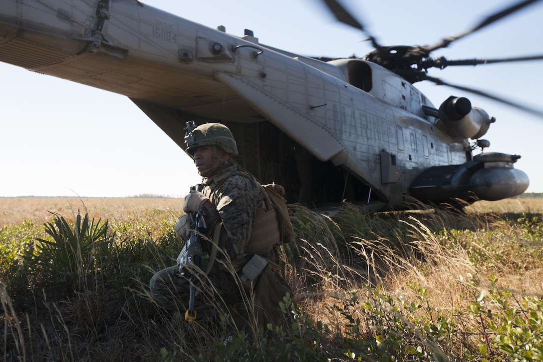 Lance Cpl. Kevin S. Millican stands security during casualty evacuation drills at Fort Stewart, S.C., Feb. 25, 2016. During the exercise, Marines trained in events such as casualty evacuation, assault support missions and aerial refueling, proving the Marine Air-Ground Task Force is a highly effective combat force. Millican is a rifleman with 3rd Battalion, 6th Marine Regiment. (U.S. Marine Corps photo by Pfc. Nicholas P. Baird/Released)