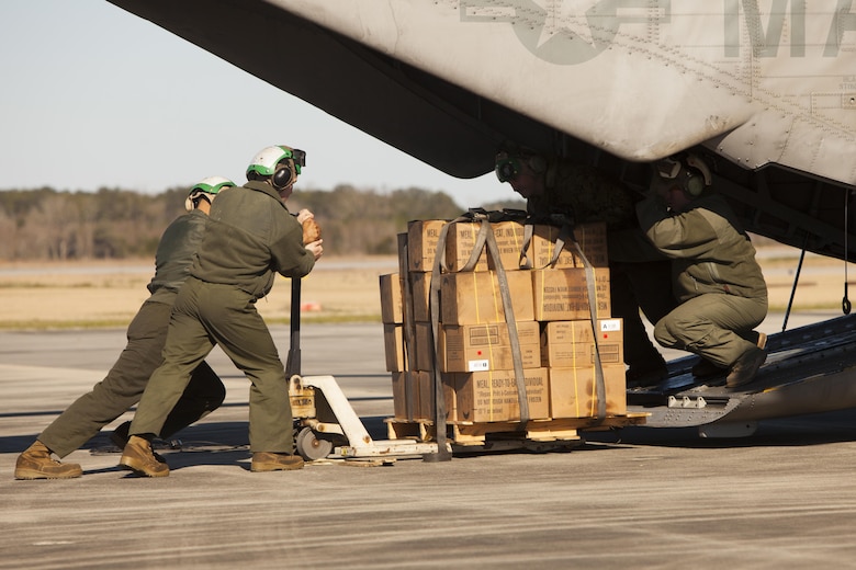 Marines with Marine Heavy Helicopter Squadron 366 load a CH-53E Super Stallion with meals, ready-to-eat during Exercise Eager Response at Marine Corps Air Station Beaufort, S.C., Feb. 25, 2016. Marines trained in events such as casualty evacuation, assault support missions and aerial refueling, proving the Marine Air-Ground Task Force is a highly effective combat force. (U.S. Marine Corps photo by Pfc. Nicholas P. Baird/Released)