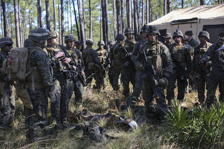 Marines with India Company, 3rd Battalion, 6th Marine Regiment, prepare to conduct a simulated casualty evacuation as part of exercise Eager Response at Fort Stewart, Ga., Feb. 26, 2016. The battalion conducted the training with the support of a CH-53E Super Stallion operated by Marines with Marine Heavy Helicopter Squadron 366. During Exercise Eager Response, Marines trained in events such as casualty evacuation, assault support missions and aerial refueling, proving the Marine Air-Ground Task Force is a highly effective combat force. (U.S. Marine Corps photo by Cpl. Paul S. Martinez/Released)