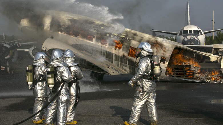 U.S. Marines and Royal Thai sailors use roof turrets to put out an engulfed aircraft during a training event as part of Cobra Gold 16 at Utapao, Thailand, Feb. 19, 2016. The roof turrets are part of the beginning stages of putting out an engulfed aircraft, followed by spraying away fuel and putting out spot fires using hand lines. Cobra Gold 16 is a multi-national exercise designed to increase interoperability between participating nations to ensure security and peace in the Asia-Pacific region. The Marines are with the aviation rescue and firefighting section with Marine Wing Support Squadron 172, Marine Aircraft Group 36, 1st Marine Aircraft Wing, III Marine Expeditionary Force. 