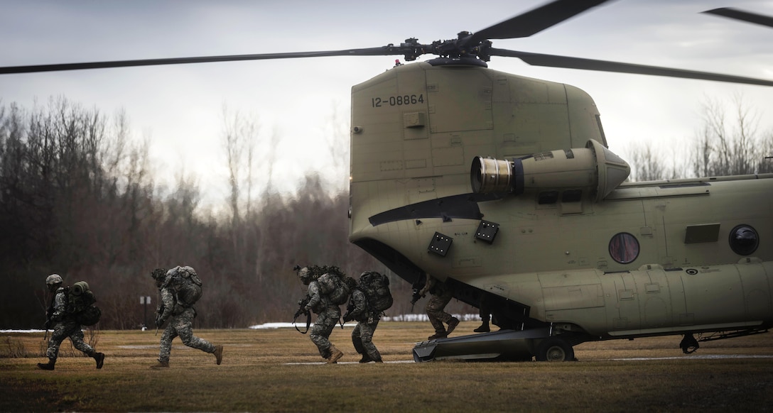 Soldiers simulate being inserted at a landing zone from a CH-47F Chinook helicopter at the Youngstown Local Training area in Youngstown, N.Y., Feb. 20, 2016. New York Air National Guard photo by Staff Sgt. Ryan Campbell
