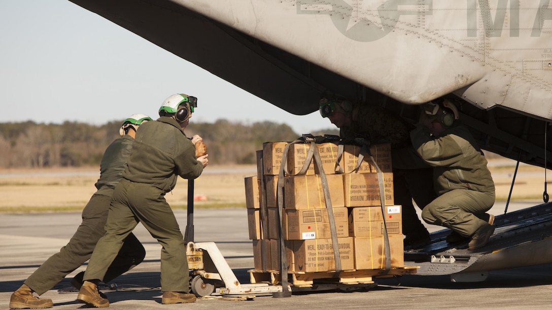 Marines with Marine Heavy Helicopter Squadron 366 load a CH-53E Super Stallion with meals, ready-to-eat during Exercise Eager Response at Marine Corps Air Station Beaufort, S.C., Feb. 25, 2016. Marines trained in events such as casualty evacuation, assault support missions and aerial refueling, proving the Marine Air-Ground Task Force is a highly effective combat force.