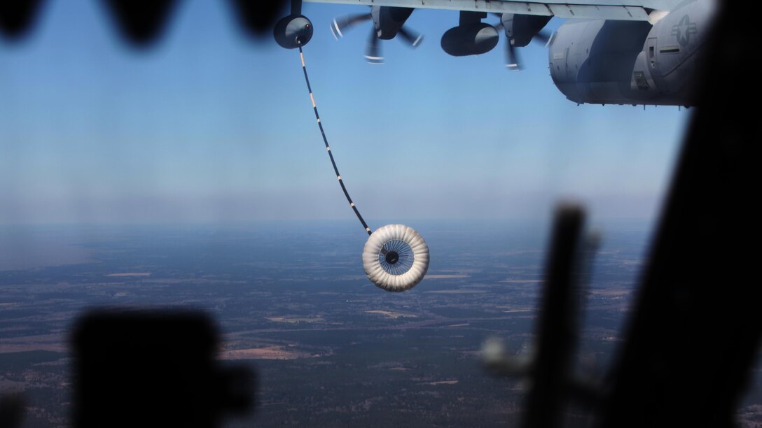 A CH-53E Super Stallion approaches a KC-130J Super Hercules refueling hose during  aerial refueling at Exercise Eager Response at Marine Corps Air Station Beaufort, S.C., Feb. 25, 2016. During the exercise, Marines trained in events such as casualty evacuation, assault support missions and aerial refueling, proving the Marine Air-Ground Task Force is a highly effective combat force. 