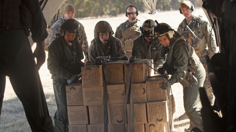 Marines with Marine Heavy Helicopter Squadron 366 load a CH-53E Super Stallion with meals, ready-to-eat during Exercise Eager Response at Marine Corps Air Station Beaufort, S.C., Feb. 25, 2016. During the exercise, Marines trained in events such as casualty evacuation, assault support missions and aerial refueling, proving the Marine Air-Ground Task Force is a highly effective combat force.