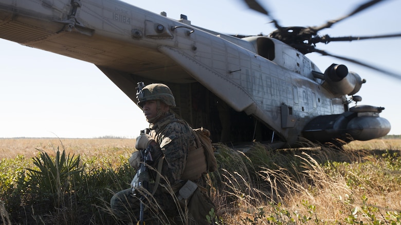 Lance Cpl. Kevin S. Millican stands security during casualty evacuation drills at Fort Stewart, S.C., Feb. 25, 2016. During the exercise, Marines trained in events such as casualty evacuation, assault support missions and aerial refueling, proving the Marine Air-Ground Task Force is a highly effective combat force. Millican is a rifleman with 3rd Battalion, 6th Marine Regiment.