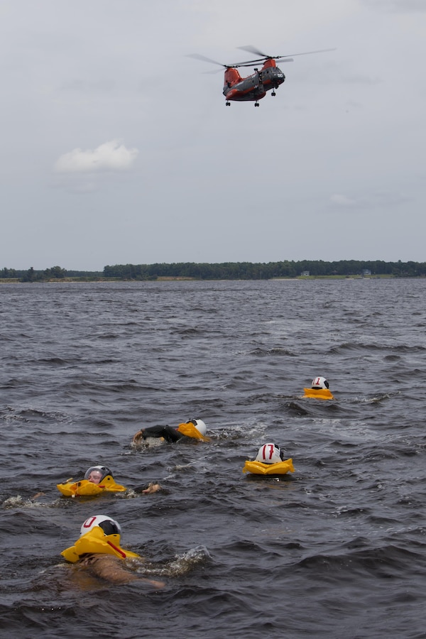 Marines and Sailors with Marine Transport Squadron 1 (VMR-1) swim towards an HH-46E Sea Knight helicopter (Pedro), also with VMR-1, during water survival training aboard Marine Corps Air Station Cherry Point. VMR-1 provides search and rescue support to MCAS Cherry Point based aircraft as well as short and medium range rapid response transport of key personnel and critical logistics. (U.S. Marine Corps official photo by Lance Cpl Steve Acuff/Released)