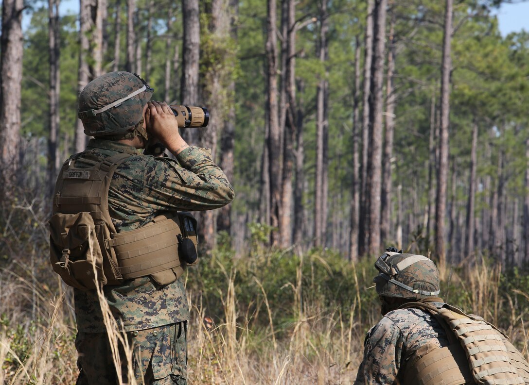 Lance Cpl. George Griffin, a rifleman with India Company, 3rd Battalion, 6th Marine Regiment, observes the surrounding area as part of exercise Eager Response at Fort Stewart, Ga., Feb. 26, 2016. The various platoons of the companies quickly established defensive positions in an area unknown to them, thus challenging their ability to adapt and operate in a new environment. During Exercise Eager Response, Marines trained in events such as casualty evacuation, assault support missions and aerial refueling, proving the Marine Air-Ground Task Force is a highly effective combat force. (U.S. Marine Corps photo by Cpl. Paul S. Martinez/Released)