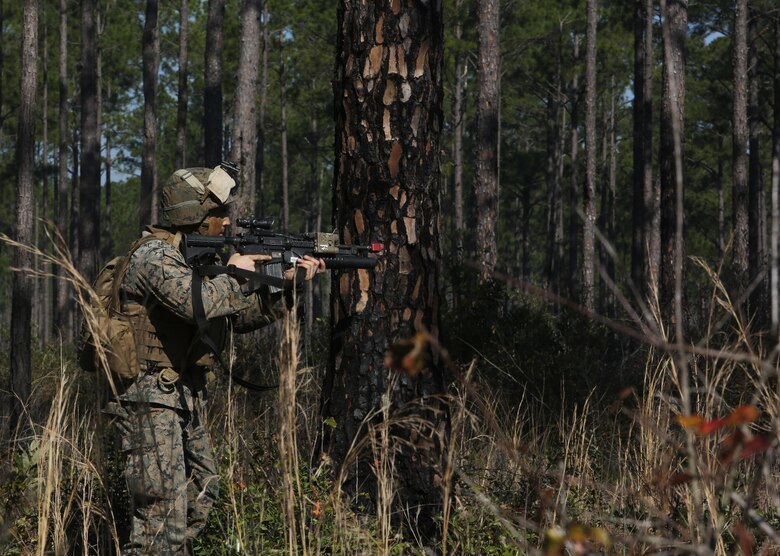 Lance Cpl. Allan C. Lammon, a team leader with India Company, 3rd Battalion, 6th Marine Regiment, defends against an opposing force as part of exercise Eager Response at Fort Stewart, Ga., Feb. 26, 2016. Throughout the exercise, a platoon-sized opposing force sporadically attacked the battalion day and night, challenging their ability to fortify and defend positions.  (U.S. Marine Corps photo by Cpl. Paul S. Martinez/Released)