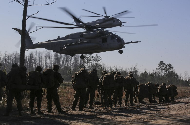 Marines with 3rd Battalion, 6th Marine Regiment, prepare to board CH-53E Super Stallions at the conclusion of exercise Eager Response at Fort Stewart, Ga., Feb. 28, 2016. The battalion was inserted and extracted via MV-22 Ospreys and CH-53E Super Stallions assigned to the 2nd Marine Aircraft Wing. (U.S. Marine Corps photo by Cpl. Paul S. Martinez/Released)