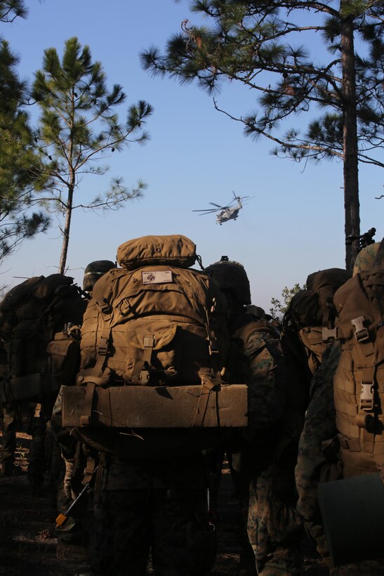 Marines with 3rd Battalion, 6th Marine Regiment, prepare to board CH-53E Super Stallion helicopters at the conclusion of exercise Eager Response at Fort Stewart, Ga., Feb. 28, 2016. The battalion was inserted and extracted via MV-22 Ospreys and CH-53E Super Stallions assigned to the 2nd Marine Aircraft Wing. (U.S. Marine Corps photo by Cpl. Paul S. Martinez/Released)
