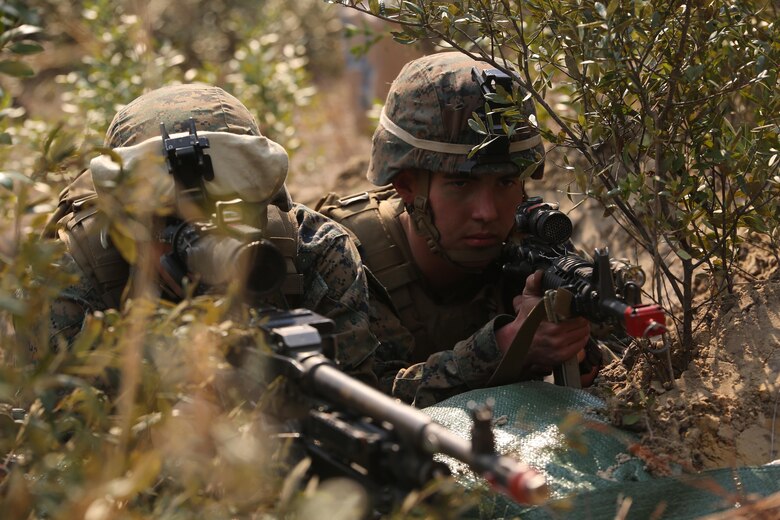 Marines with 3rd Battalion, 6th Marine Regiment, secure defensive positions as part of exercise Eager Response at Fort Stewart, Ga., Feb. 26, 2016. Throughout the exercise, a platoon-sized opposing force sporadically attacked the battalion day and night, challenging their ability to fortify and defend positions. (U.S. Marine Corps photo by Cpl. Paul S. Martinez/Released)