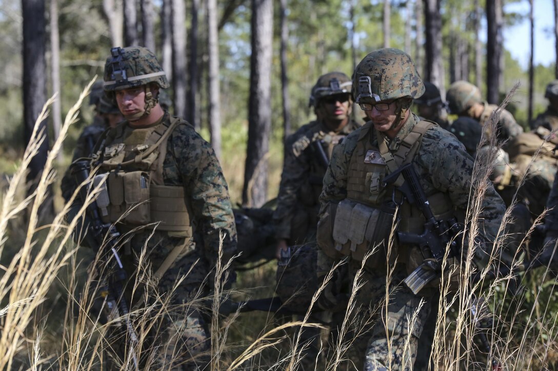 Marines with India Company, 3rd Battalion, 6th Marine Regiment, conduct a simulated casualty evacuation as part of exercise Eager Response at Fort Stewart, Ga., Feb. 26, 2016. The battalion conducted the training with the support of a CH-53E Super Stallion operated by Marines with Marine Heavy Helicopter Squadron 366. During Exercise Eager Response, Marines trained in events such as casualty evacuation, assault support missions and aerial refueling, proving the Marine Air-Ground Task Force is a highly effective combat force. (U.S. Marine Corps photo by Cpl. Paul S. Martinez/Released)