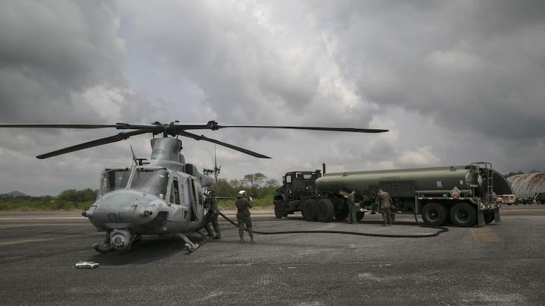 Marines work diligently to refuel a UH-1Y Huey before a flight mission during Cobra Gold 16 in Utapao, Thailand, Feb. 16, 2016. Cobra Gold is a multi-national exercise with aims to increase well-being and relationships between participating nations in the Asia-Pacific. The Marines are with Marine Wing Support Squadron 172, Marine Aircraft Group 36, 1st Marine Aircraft Wing, III Marine Expeditionary Force, and Marine Light Attack Helicopter Squadron 167 currently supporting MAG 36 under the unit deployment program.