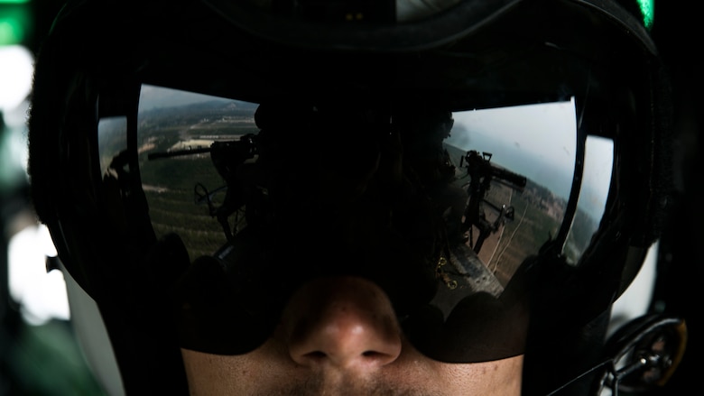 Lance Cpl. Rommi S. Swelam observes his fellow crew chiefs in a UH-1Y Huey during a flight as part of Cobra Gold 16 in Utapao, Thailand, Feb. 16, 2016. The Huey gives crew chiefs the advantage of having a “God’s eye” view of the environment below. Cobra Gold is a multi-national exercise designed to increase interoperability and cooperation of participating nations by working toward solutions to common challenges. Swelam, from Raleigh, N.C., is a crew chief with Marine Light Attack Helicopter Squadron 167 which is currently supporting Marine Aircraft Group 36, 1stj Marine Aircraft Wing, III Marine Expeditionary Force under the unit deployment program.