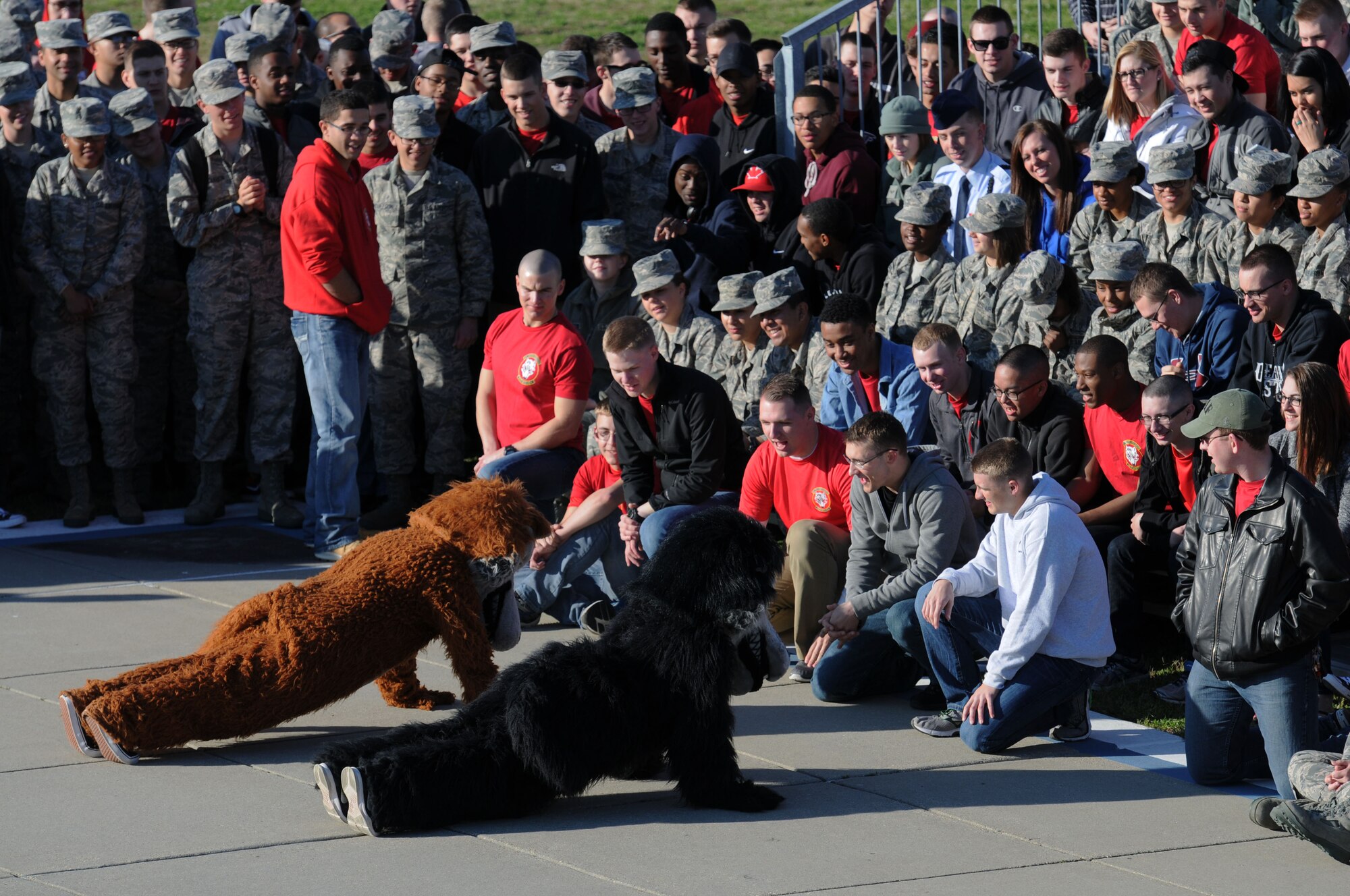 The 336th Training Squadron mascots compete in a push-up contest during the 81st Training Group drill down at the Levitow Training Support Facility drill pad Feb. 26, 2016, Keesler Air Force Base, Miss. The 336th TRS “Red Wolves” placed first in freestyle. (U.S. Air Force photo by Kemberly Groue)