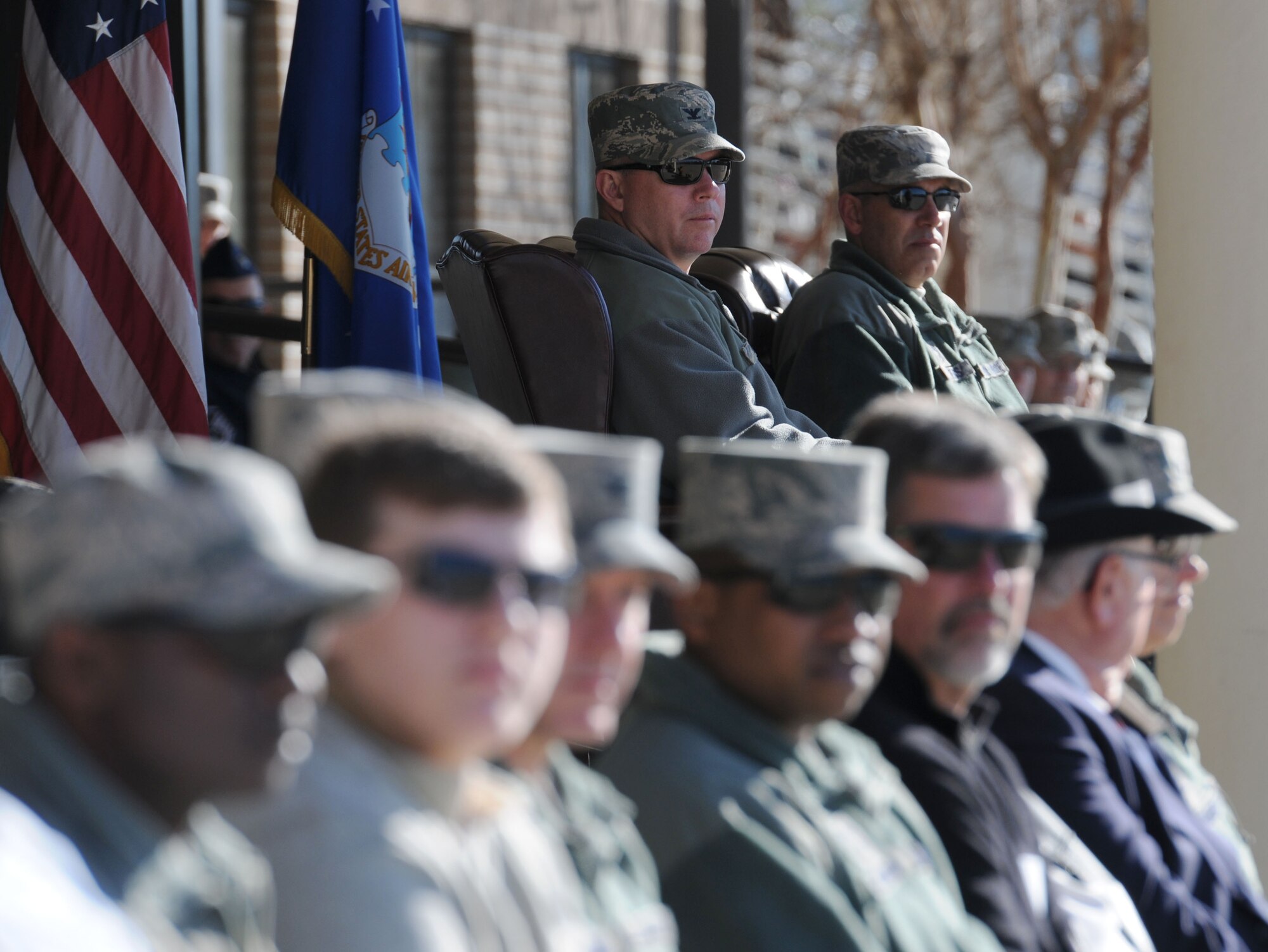 Col. Scott Solomon, 81st Training Group commander, and Chief Master Sgt. Robert Winters, 81st TRG superintendent, watch Airmen perform during the 81st TRG drill down at the Levitow Training Support Facility drill pad Feb. 26, 2016, Keesler Air Force Base, Miss. The 334th TRS “Gators” were the overall winners for the event. (U.S. Air Force photo by Kemberly Groue)