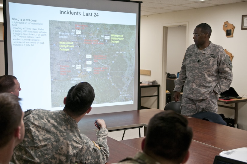 U.S. Army Reserve Soldiers with the 961st Engineer Battalion, provide a command update brief to Lt. Col. Maynard Spell, commander, 961st Engineer Battalion, during the 961st Engineer Battalion's third Defense Support of Civil Authorities tabletop exercise in Seagoville, Texas, Feb. 25 to 28. (U.S. Army photo by Staff Sgt. Debralee Best)