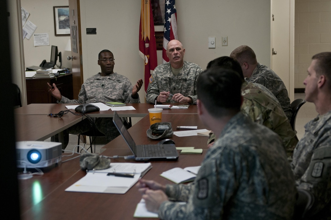 U.S. Army Reserve Soldiers with the 961st Engineer Battalion, provide a command update brief to Lt. Col. Maynard Spell, commander, 961st Engineer Battalion, during the 961st Engineer Battalion's third Defense Support of Civil Authorities tabletop exercise in Seagoville, Texas, Feb. 25 to 28. (U.S. Army photo by Staff Sgt. Debralee Best)