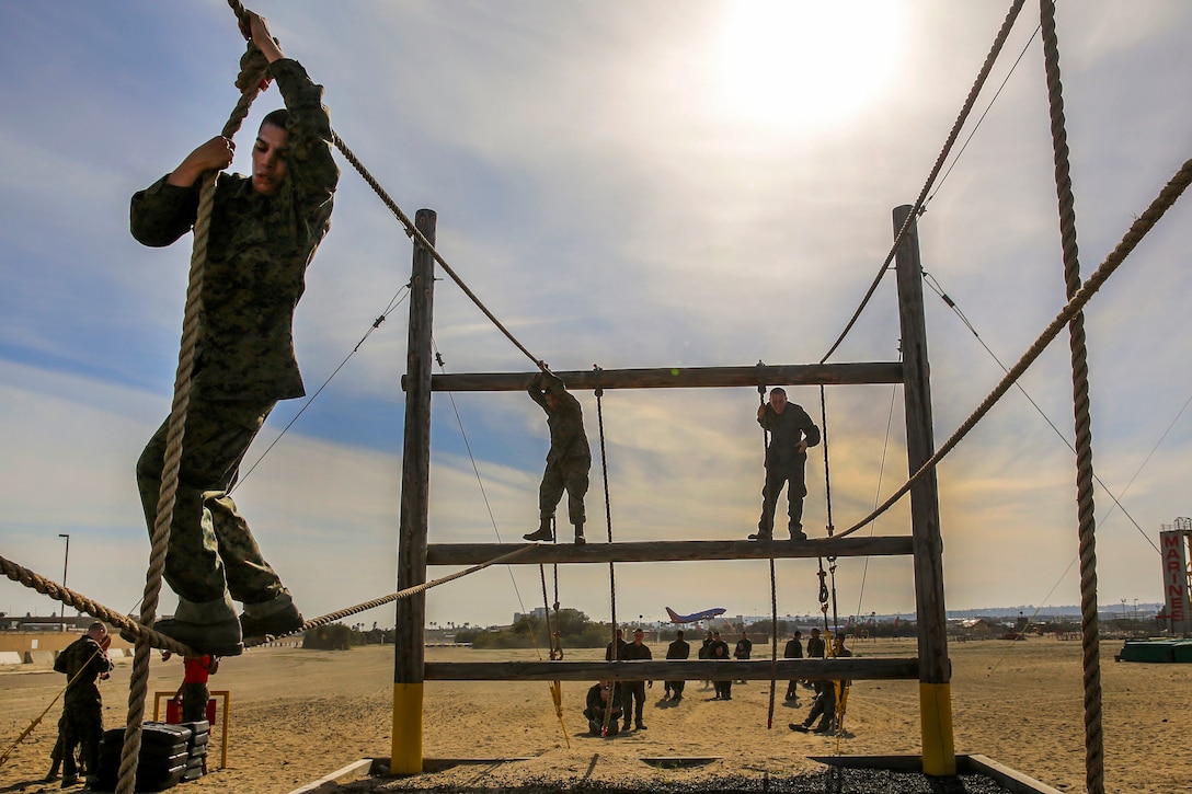 Marine Corps recruits tackle the rope bridge obstacle on the confidence course at Marine Corps Recruit Depot San Diego, Feb. 23, 2016. Marine Corps photo by Lance Cpl. Angelica I. Annastas 